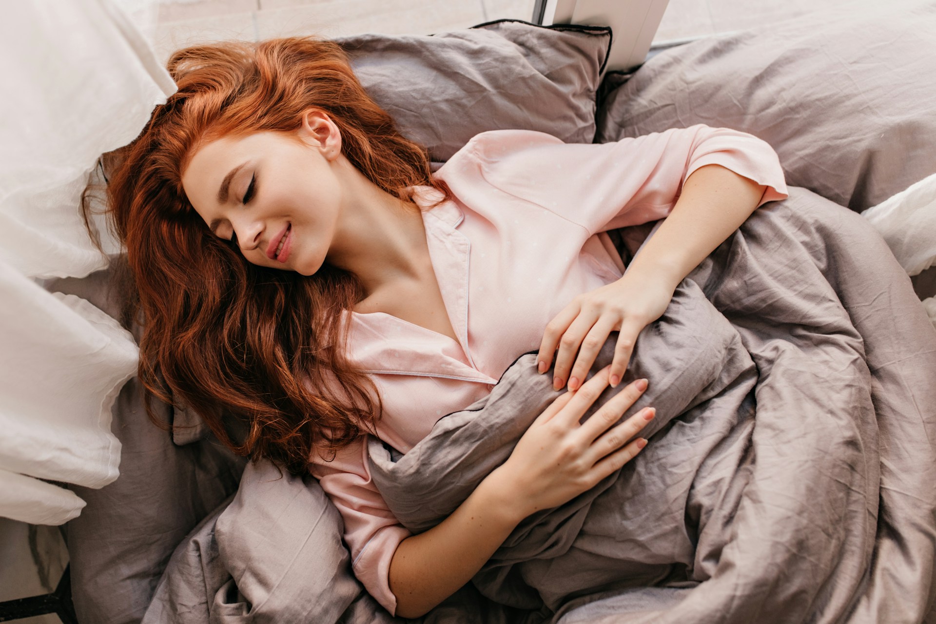 Person sleeping peacefully in comfortable bed